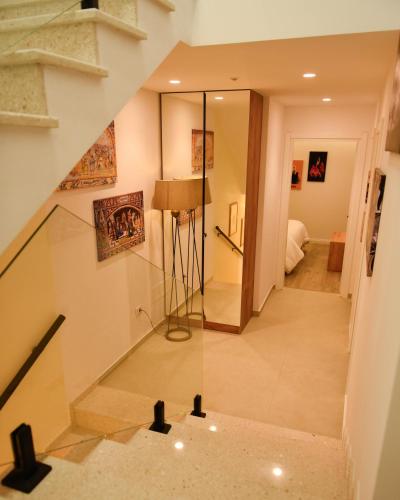 a staircase in a house with a glass floor at Hotel Delicia in Shkodër
