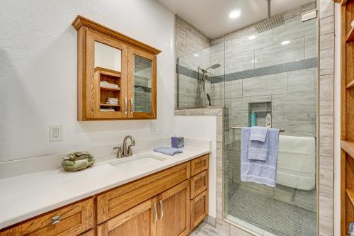 a bathroom with a sink and a shower at Walking Trail On-Site Tranquil Klamath Falls Apt! in Klamath Falls