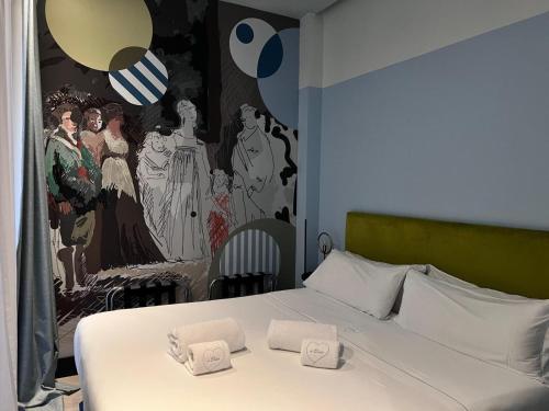 Łóżko lub łóżka w pokoju w obiekcie Amor de Dios 17 Boutique Apartments