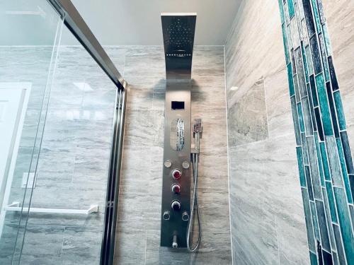 a walk in shower with a glass door at Cozy Beautiful 2BD Apt in Center City in Philadelphia