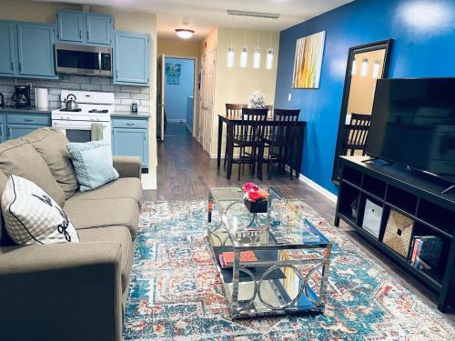 a living room with a couch and a table at Cozy Beautiful 2BD Apt in Center City in Philadelphia