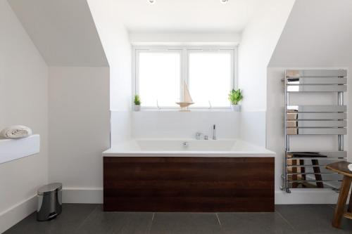 a bathroom with a sink and a window at Gorgeous home for 12 - Walk to Beach - Sea View in Chichester