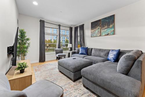a living room with a couch and a table at Beautiful 2BR in Southend Boston in Boston
