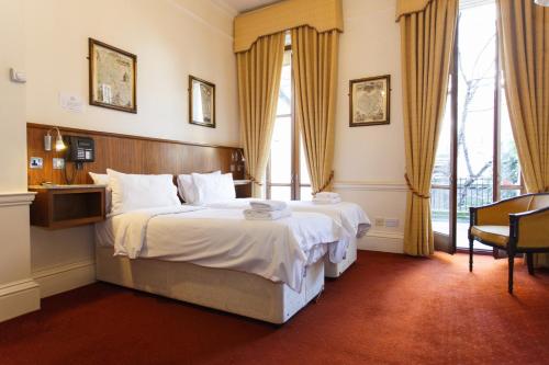 Ένα ή περισσότερα κρεβάτια σε δωμάτιο στο Morgan Hotel
