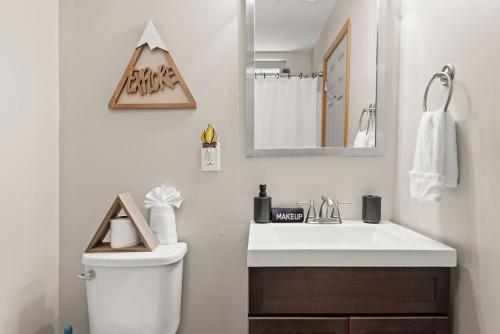 a bathroom with a white sink and a mirror at Love Lace Retreat in Albrightsville