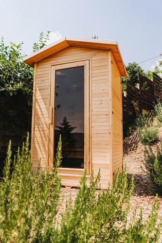 a small wooden dog house in a garden at Ringat-Lak Panoramic hideout just for 2 in Nagymaros