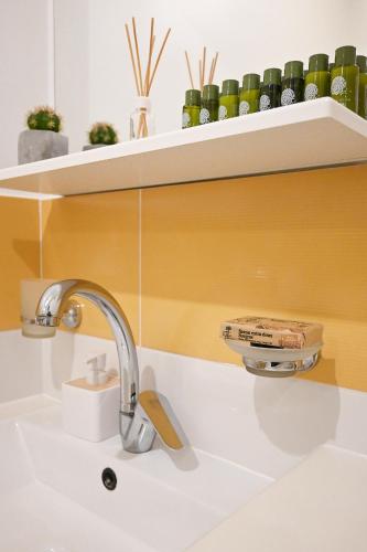 a sink with a faucet on a white counter at Vila Maričić in Sveti Petar