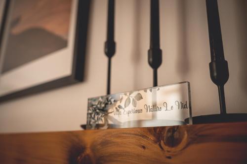 a glass trophy sitting on top of a wooden table at Villa Experience Nature Le Nid in Saint-Irénée