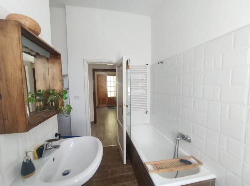a white bathroom with a sink and a shower at Italia Highland Retreat in Abruzzo in Verrecchie
