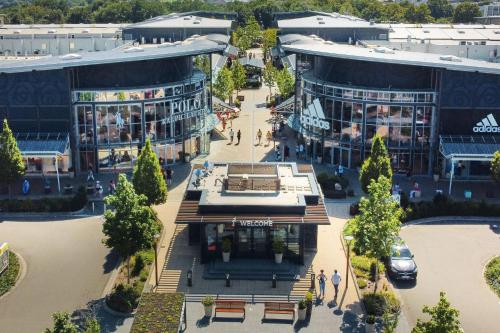 an aerial view of a shopping center with buildings at Ferienwohnung Schlabbeflicker Pirmasens in Pirmasens