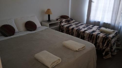 Ένα ή περισσότερα κρεβάτια σε δωμάτιο στο Departamentos en Cafayate BuenaVid
