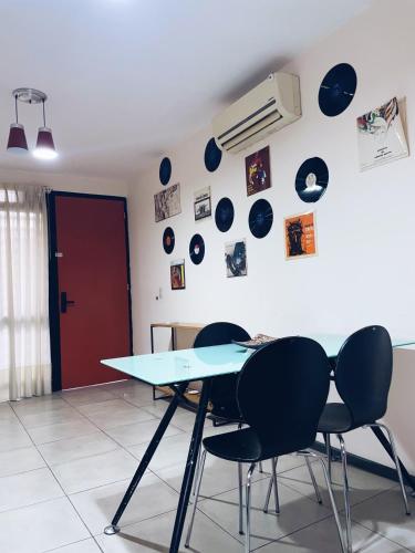 a blue table and chairs in a room at PDLA Apartment in Mendoza