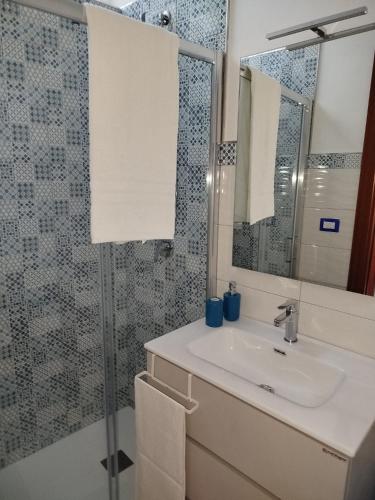 a bathroom with a sink and a shower at Casa Anteresa in Vietri sul Mare