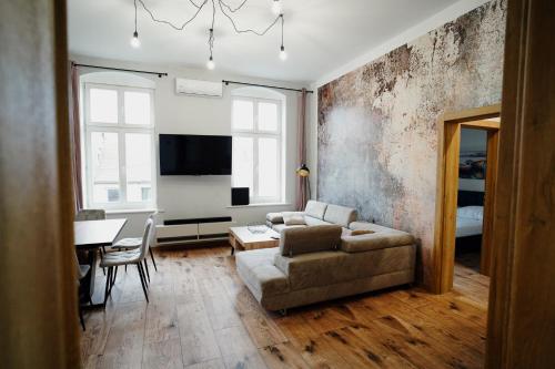 TV a/nebo společenská místnost v ubytování Apartament Novy Drezdenko