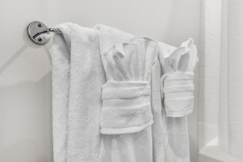 a white towel hanging on a towel rack in a bathroom at Beautiful 2BR in Southend Boston in Boston