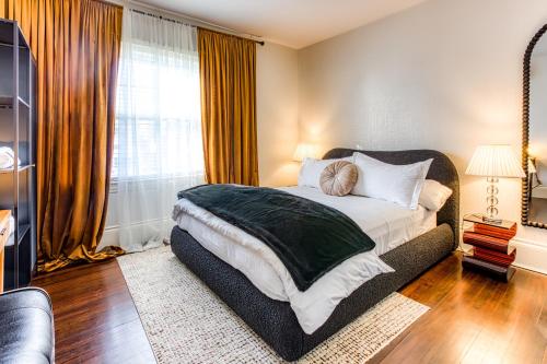 a bedroom with a large bed and a window at Doctor Sax House in Lenox