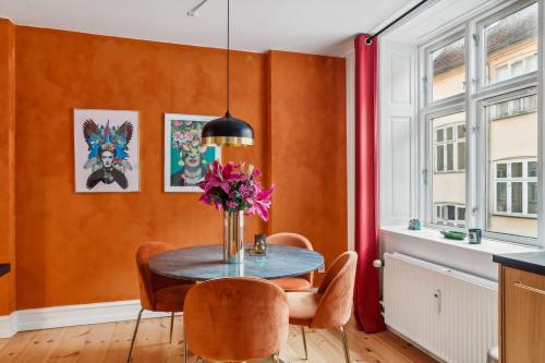 a dining room with a table and chairs at Best Location - 5 Min To Tivoli And Main Station in Copenhagen