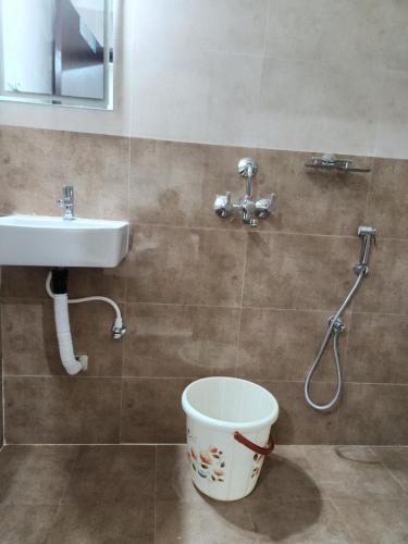 a bathroom with a sink and a toilet at Modern New 2 BHK Studios in Kondapur Near Gachibowli in Hyderabad