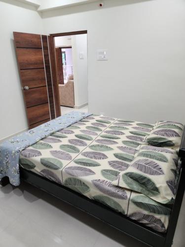 a bed sitting in a room with a bedroom at Modern New 2 BHK Studios in Kondapur Near Gachibowli in Hyderabad