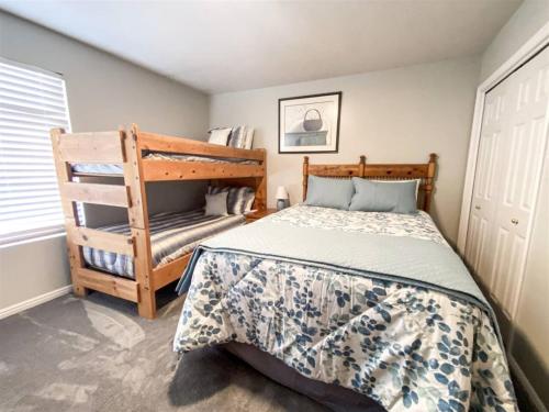 a bedroom with a bed and a ladder in it at 14-Plex 218 in Garden City