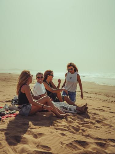 a group of women sitting on the beach at BABERRIH Hôtel Hospitality Palaces & Resorts in Essaouira