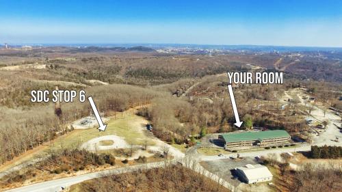an aerial view of a building with a roof and a road at Jonesbones Room at White Wing Lodge- Silver Dollar City Getaway in Branson