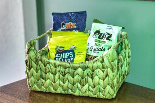 a basket of chips and snacks on a table at Jonesbones Room at White Wing Lodge- Silver Dollar City Getaway in Branson