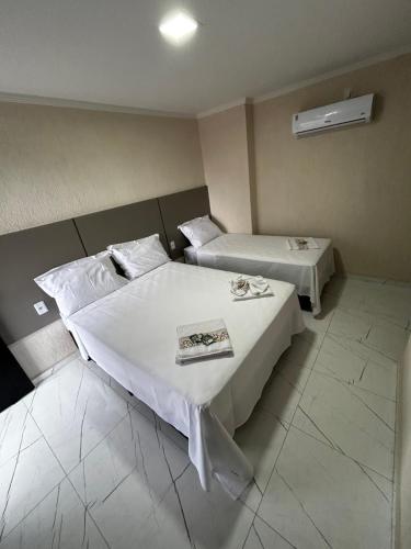 Postel nebo postele na pokoji v ubytování Hotel Aris