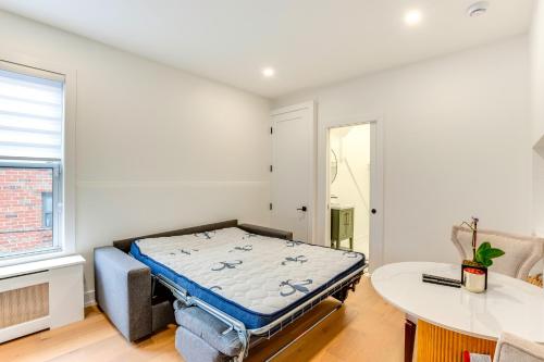 a bedroom with a bed in a room at Centrally Located and Pet Friendly Yonkers Studio! in Yonkers