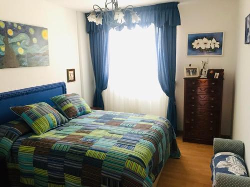 En eller flere senge i et værelse på Casa Mila