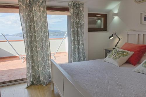 Ένα ή περισσότερα κρεβάτια σε δωμάτιο στο Apartments La Turistica