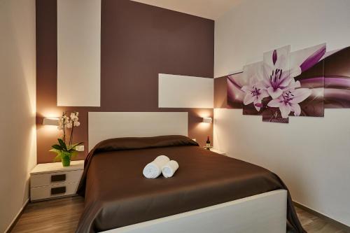 Ένα ή περισσότερα κρεβάτια σε δωμάτιο στο Il Vecchio Marsala