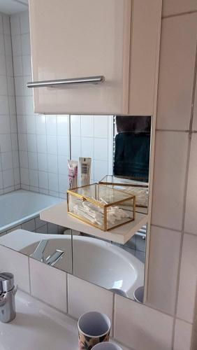 a bathroom with a sink and a bath tub at Mia Casa in Kehl am Rhein