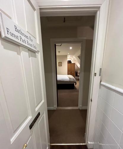 a door leading into a guest room with a bedroom at Park Farm in Windsor