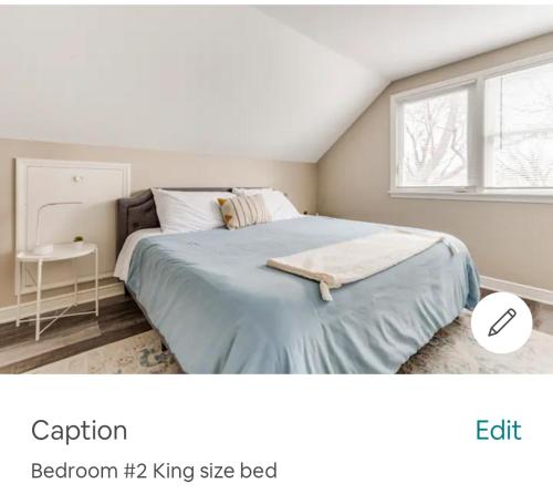 a bedroom with a large bed and a window at Entire Four Bedrooms House Close to Downtown Minneapolis Minneapolis, U of m US Bank Stadium in Minneapolis
