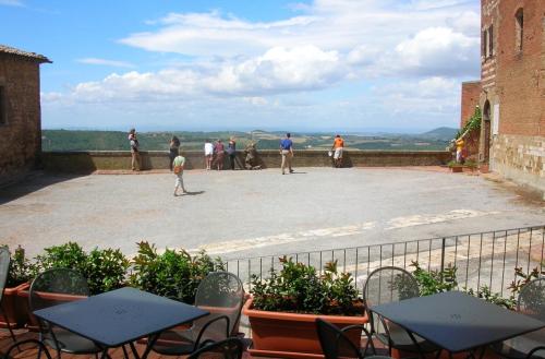 a group of tables and chairs on a patio at La Locanda Di San Francesco in Montepulciano