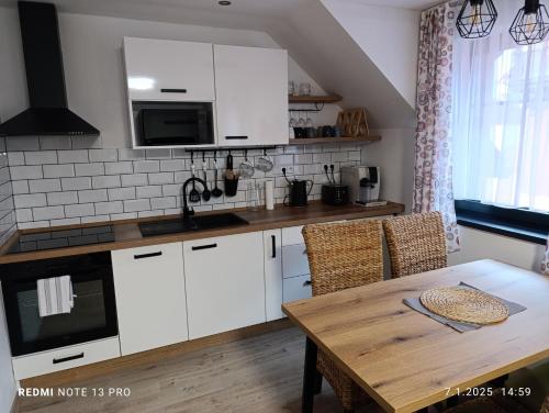 Kuchyň nebo kuchyňský kout v ubytování Apartmány Zdíkov