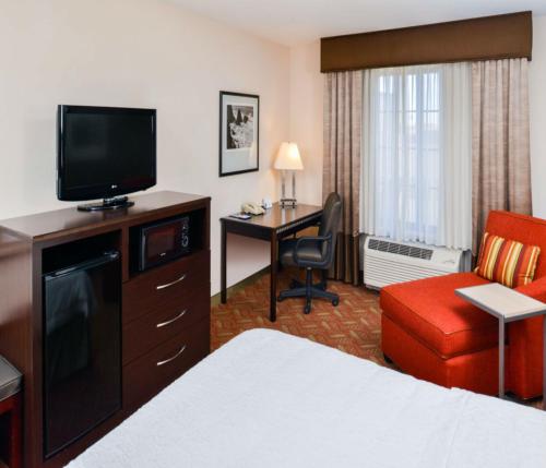 a hotel room with a bed a desk and a television at Hampton Inn & Suites San Francisco-Burlingame-Airport South in Burlingame