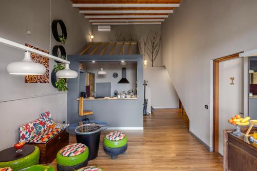a living room with a couch and a table at Studio OF in Leonforte