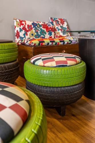 a room with a stack of tire chairs and pillows at Studio OF in Leonforte