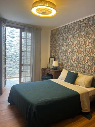 Ένα ή περισσότερα κρεβάτια σε δωμάτιο στο Casa das Flores Funchal