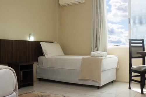 Postel nebo postele na pokoji v ubytování Hotel Caverá