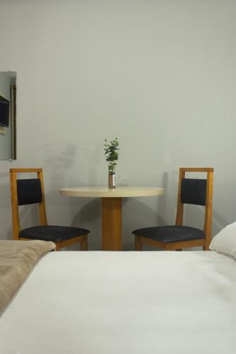 Postel nebo postele na pokoji v ubytování Hotel Caverá