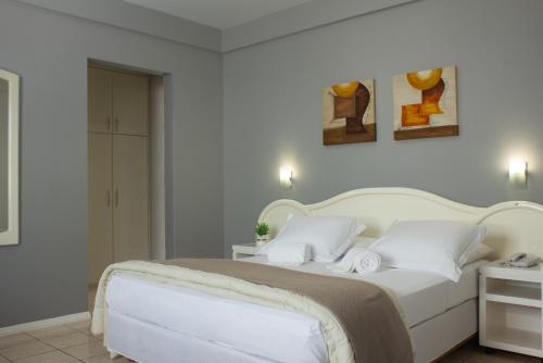 Postel nebo postele na pokoji v ubytování Hotel Caverá