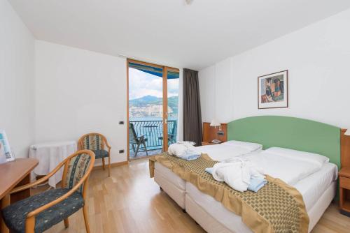Postel nebo postele na pokoji v ubytování Hotel Venezia