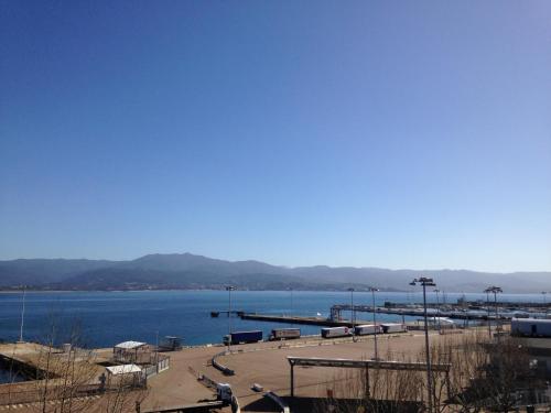 a view of a body of water with a dock at Hotel le Dauphin in Ajaccio
