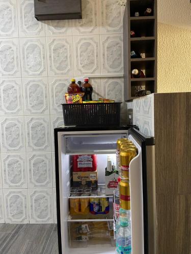 an open refrigerator with food and drinks in it at Apartamento Paipa Boyacá "Las Quintas" in Paipa