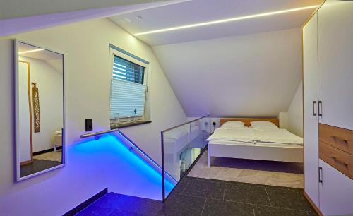 a room with a bed and a swimming pool at STERK Apartments - idyllisch - modern - stilvoll in Meckenbeuren