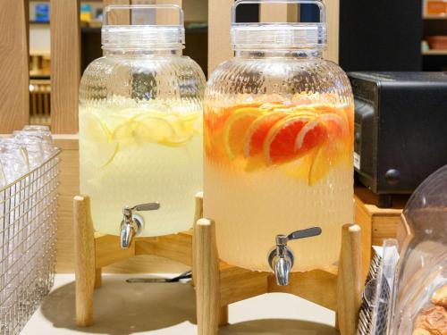 two bottles of lemonade sitting on a counter at Comfort Hotel ERA Kobe Sannomiya in Kobe