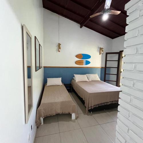 Ένα ή περισσότερα κρεβάτια σε δωμάτιο στο Residencial Canto da Praia - Jureia 30mts da praia